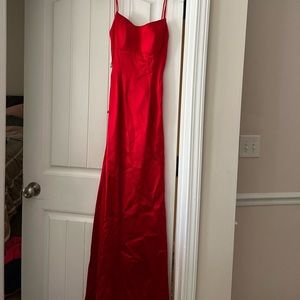 two  brand-new prom dresses and the cotillion dress has been worn once